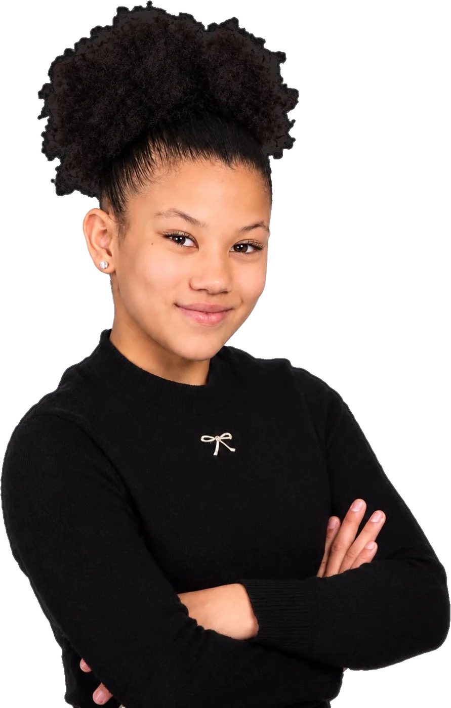 Aylin Méndez in a black sweater, arms crossed, smiling