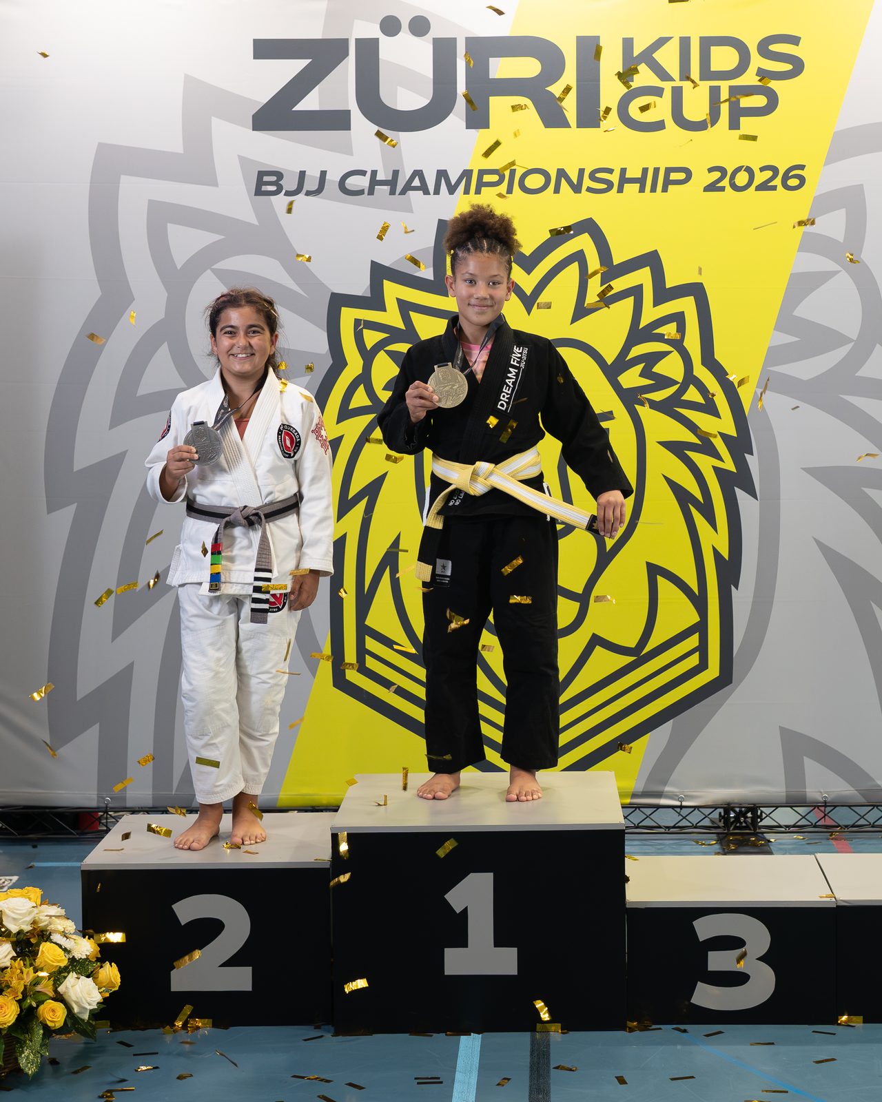 Aylin on top of the podium at the Züri Kids Cup 2026, in Gi, with the gold medal.